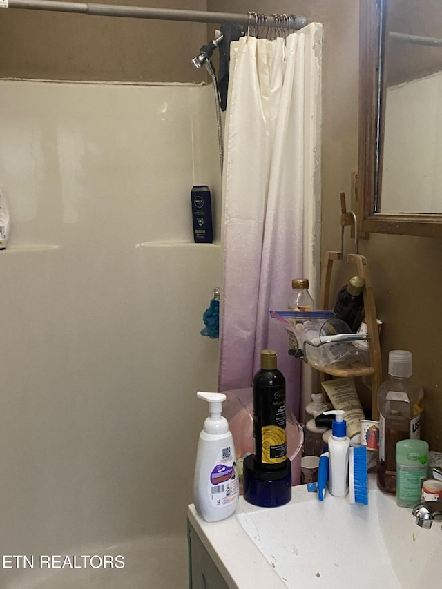 bathroom with a shower with shower curtain