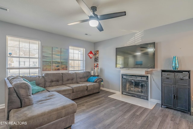 living room with hardwood / wood-style flooring and ceiling fan