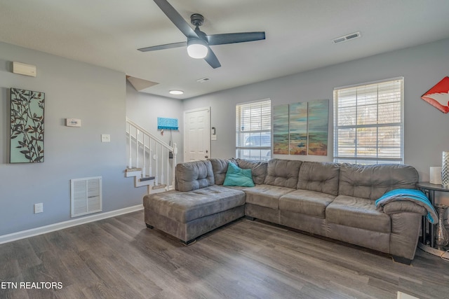 living room featuring hardwood / wood-style flooring and ceiling fan