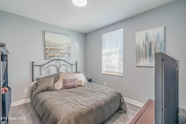 bedroom with wood-type flooring