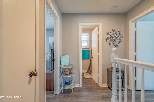 hallway with dark wood-type flooring