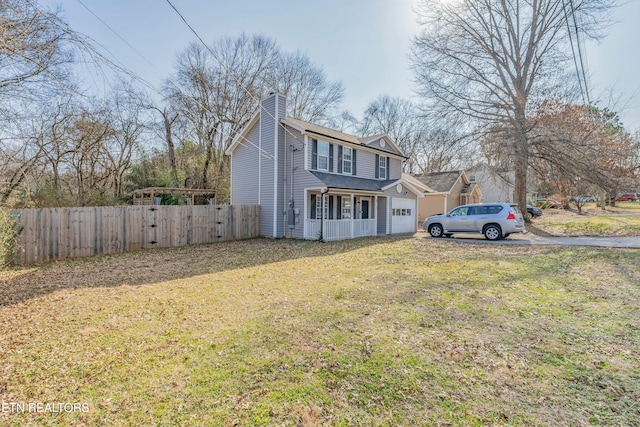 view of property featuring a porch and a front lawn