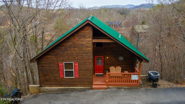 view of side of home with a mountain view