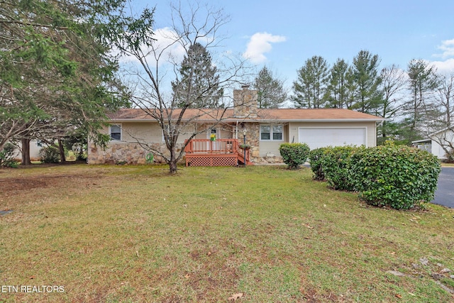 single story home with a wooden deck, a garage, and a front lawn