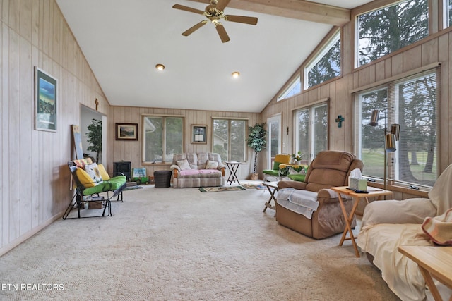 sunroom / solarium featuring vaulted ceiling with beams and ceiling fan