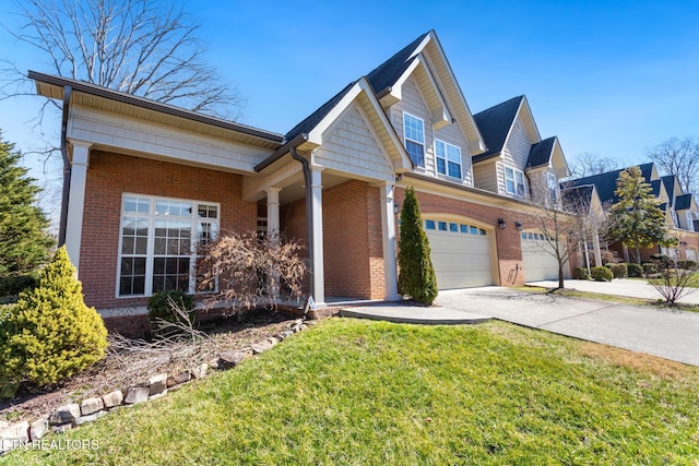 view of front of property featuring driveway, brick siding, an attached garage, and a front yard