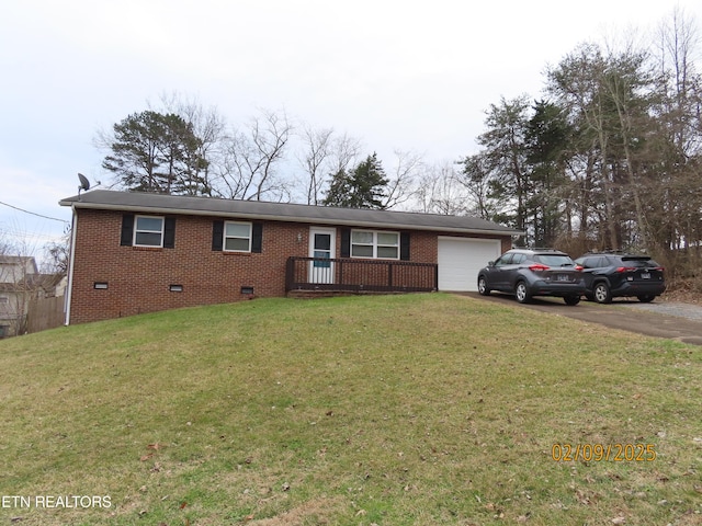 single story home featuring a garage and a front yard