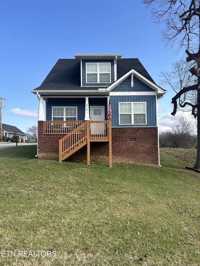 rear view of house with a yard