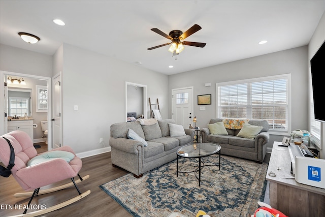 living area featuring recessed lighting, dark wood finished floors, a ceiling fan, and baseboards