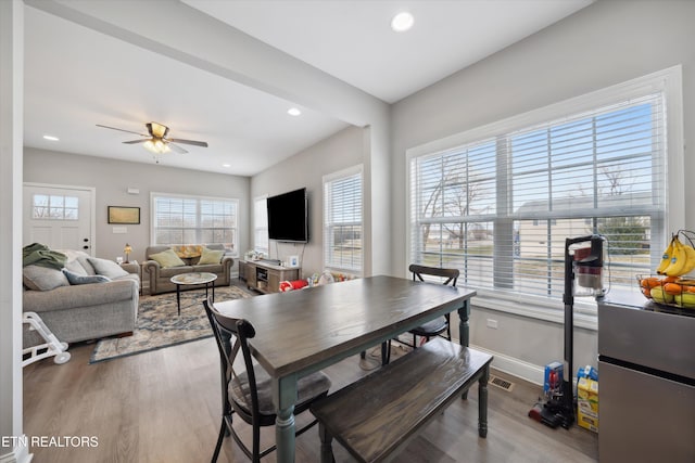 dining space with baseboards, visible vents, ceiling fan, wood finished floors, and recessed lighting