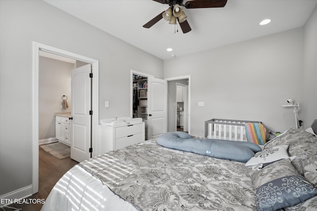 bedroom featuring baseboards, a ceiling fan, connected bathroom, dark wood-style floors, and recessed lighting