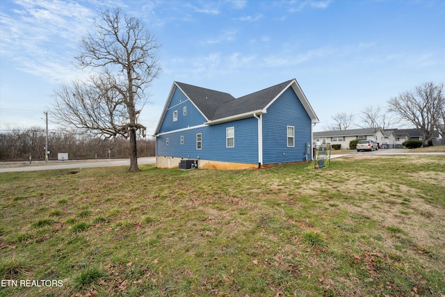 view of property exterior featuring a yard and central air condition unit