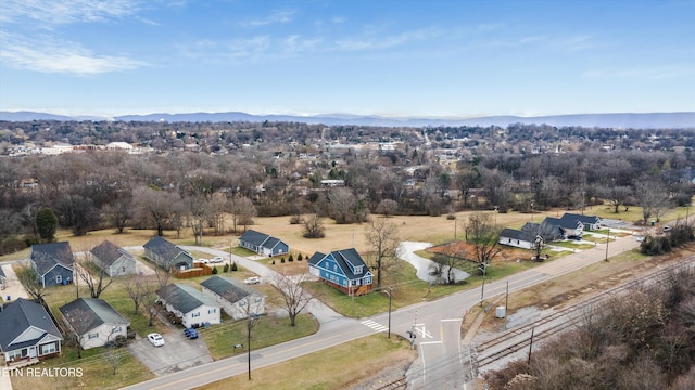 drone / aerial view with a residential view and a mountain view