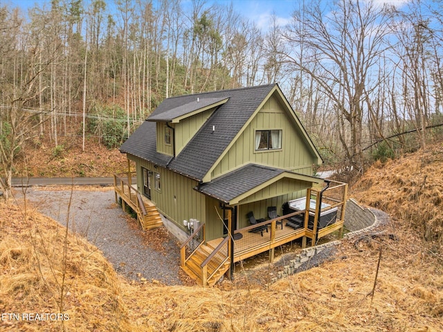 view of front of home featuring roof with shingles