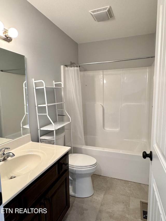 full bathroom with tile patterned flooring, vanity, shower / bath combo with shower curtain, and toilet