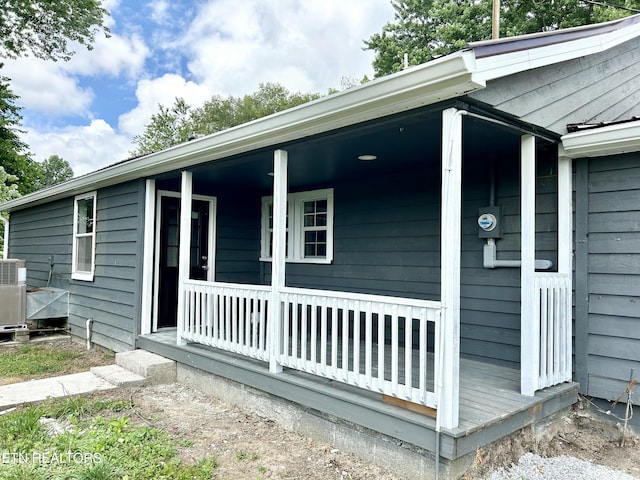 exterior space featuring cooling unit and covered porch