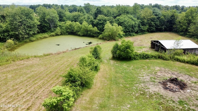 drone / aerial view featuring a water view and a rural view