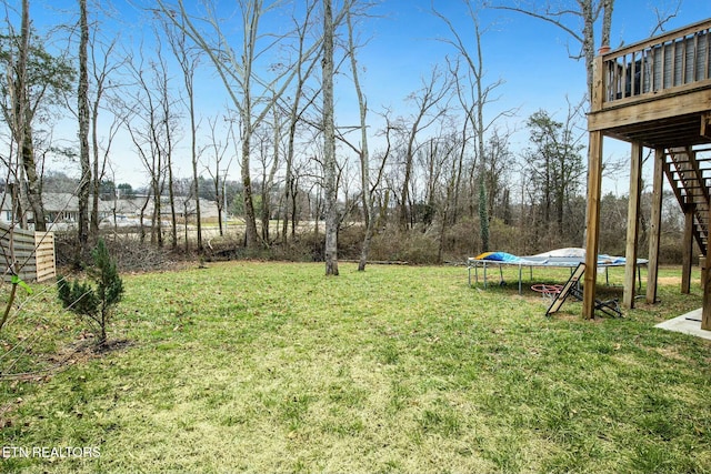 view of yard with a trampoline