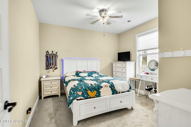 carpeted bedroom with ceiling fan