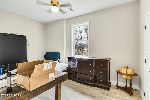 office space featuring ceiling fan and light wood-type flooring