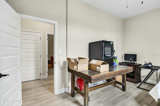 office area with light hardwood / wood-style floors