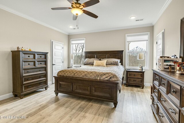 bedroom featuring ornamental molding, ceiling fan, and light wood-type flooring