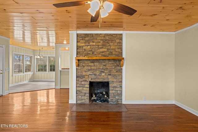 unfurnished living room featuring hardwood / wood-style floors, wood ceiling, and a fireplace