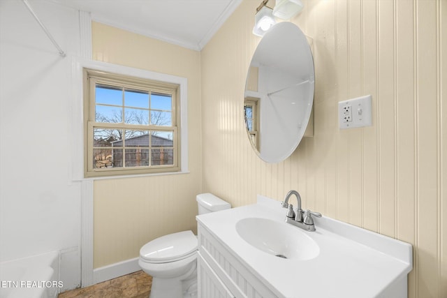 bathroom featuring vanity, ornamental molding, and toilet