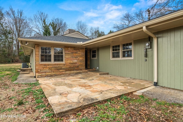 exterior space featuring cooling unit and a patio area