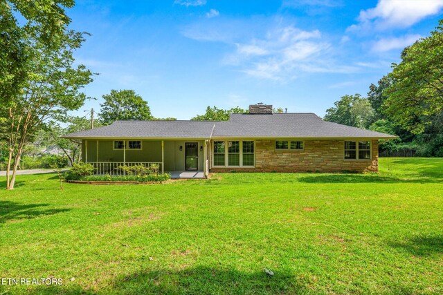 19 Shawnee Trl, Athens, TN 37303 - back of house with a chimney, a yard, and stone siding