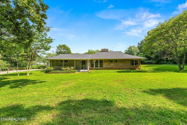 19 Shawnee Trl, Athens, TN 37303 - rear view of house featuring a lawn and a chimney
