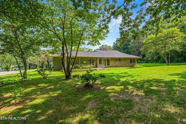 19 Shawnee Trl, Athens, TN 37303 - exterior space with a front lawn and a chimney