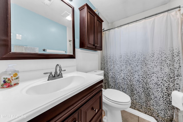 bathroom featuring vanity, tile patterned flooring, a shower with curtain, and toilet