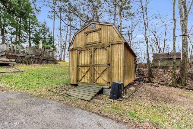 view of outdoor structure with a lawn