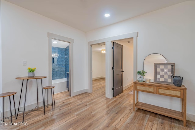 hall with light wood-type flooring