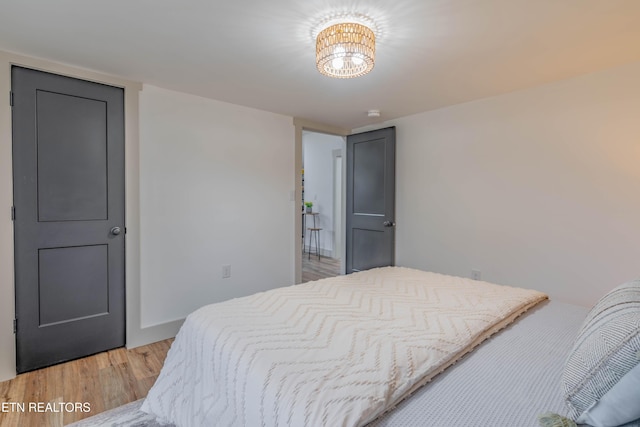 bedroom with hardwood / wood-style flooring