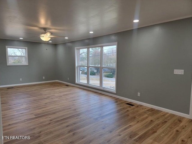 unfurnished room featuring crown molding, ceiling fan, and hardwood / wood-style floors