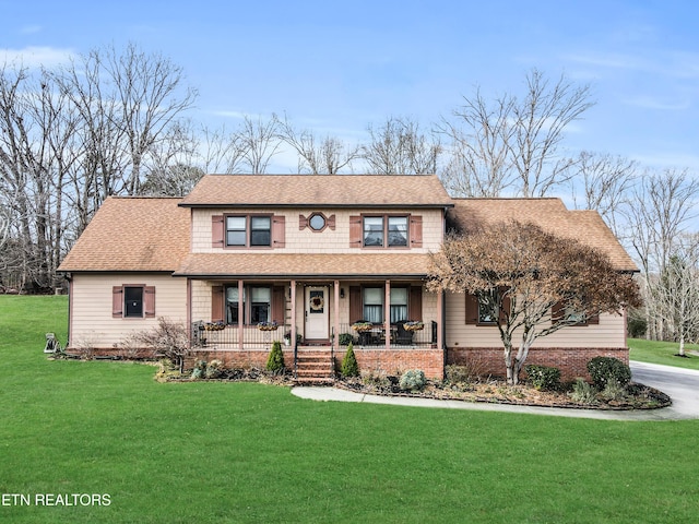 view of front of home with a front lawn and a porch