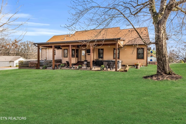 back of property featuring a patio and a yard