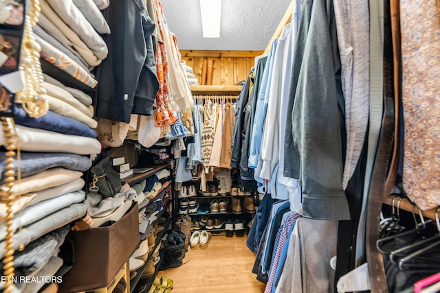 spacious closet featuring light wood-type flooring