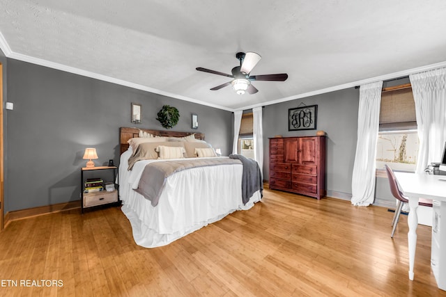 bedroom with ceiling fan, ornamental molding, hardwood / wood-style floors, and a textured ceiling