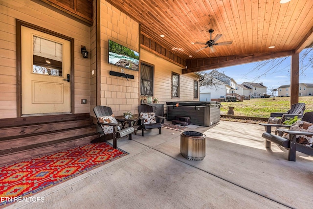 view of patio / terrace with a hot tub and ceiling fan