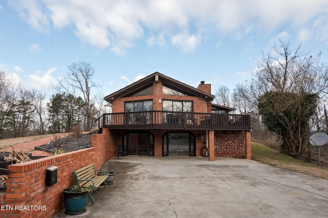 back of house featuring a deck