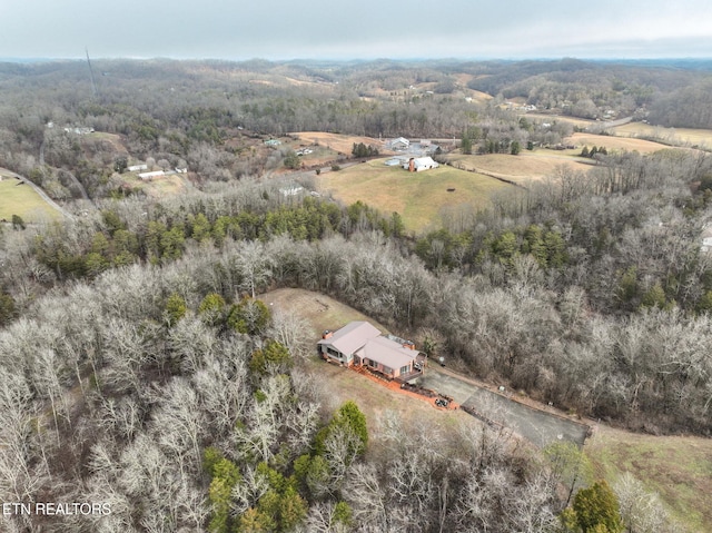 birds eye view of property with a rural view