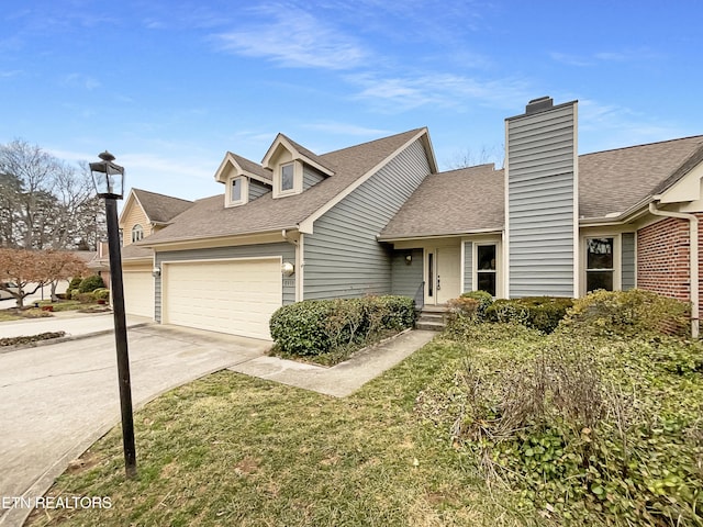 view of front facade featuring a garage and a front lawn