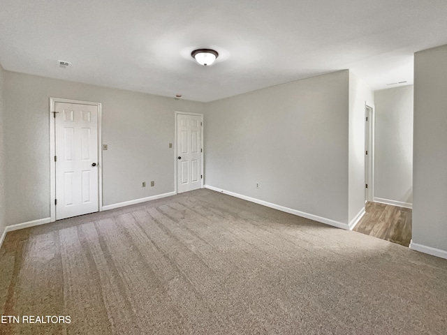 empty room with carpet flooring