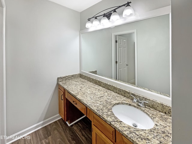 bathroom with vanity and hardwood / wood-style floors