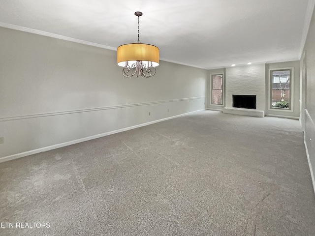 unfurnished living room with ornamental molding, a large fireplace, and carpet flooring