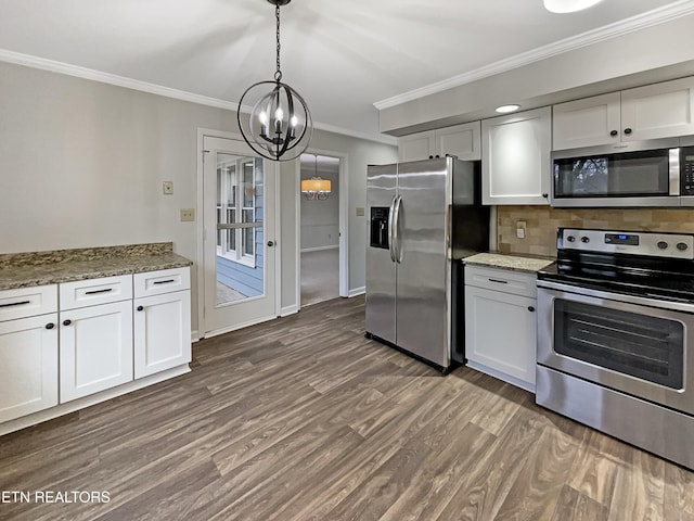 kitchen featuring white cabinetry, appliances with stainless steel finishes, decorative light fixtures, and stone counters