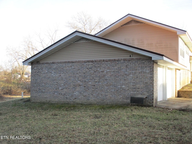 view of home's exterior featuring a yard